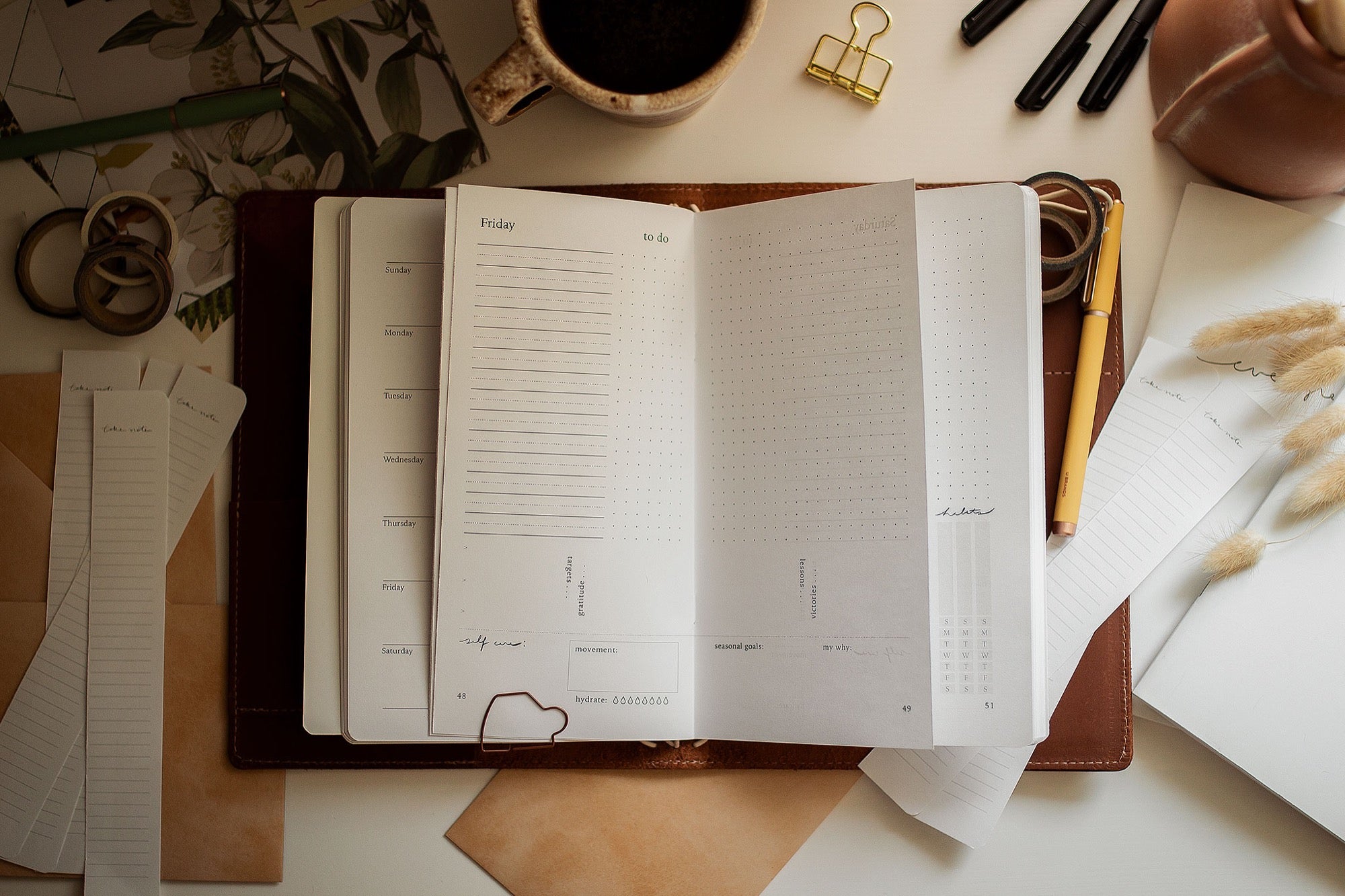 An Evergreen planner lying open on a desk