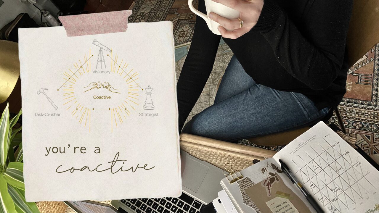 A hand-lettered “you’re a Coactive” card over a planner, laptop, and coffee